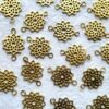 Geometric flower brass connector charm with open petals